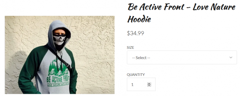 Online shop product listing for a "Be Active Front – Love Nature Hoodie" priced at $34.99. Product photo shows a person wearing a gray-and-dark-green raglan hoodie with the hood up, dark sunglasses, and a black-and-white skull-patterned face covering, standing against a textured beige stucco wall with a black strap across the chest. The hoodie's front graphic depicts cyclists riding past pine trees with text reading "BE ACTIVE FRO" and "LOVE NATURE SAVE NATURE." Page elements include a "SIZE" dropdown set to "-- Select --" and a "QUANTITY" field showing 1.