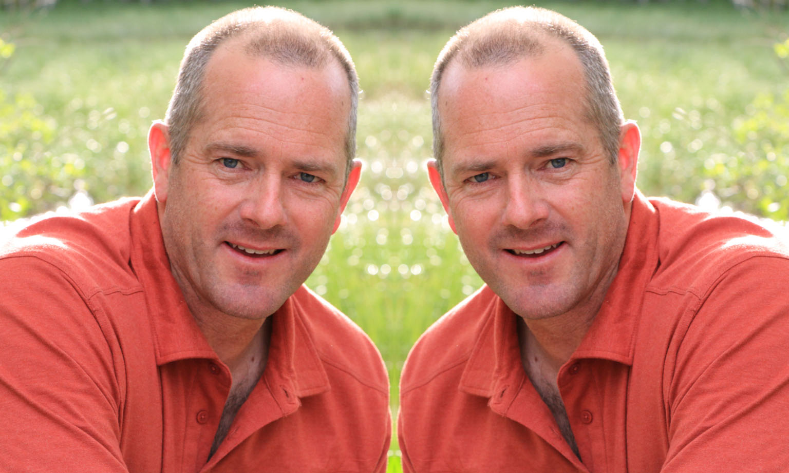 Tom Ramsey of Westmark design and Construction in a red polo shirt in front of grass