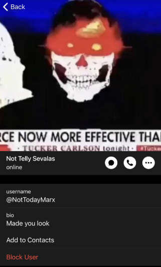 A messaging app profile screenshot. Profile photo shows a person wearing a skull-themed mask with red coloring on top; a news ticker behind reads "TUCKER CARLSON tonight" with partial text "NOW MORE EFFECTIVE THAN." Name: "Not Telly Sevalas," username "@NotTodayMarx," bio "Made you look," with "Add to Contacts" and "Block User" options.
